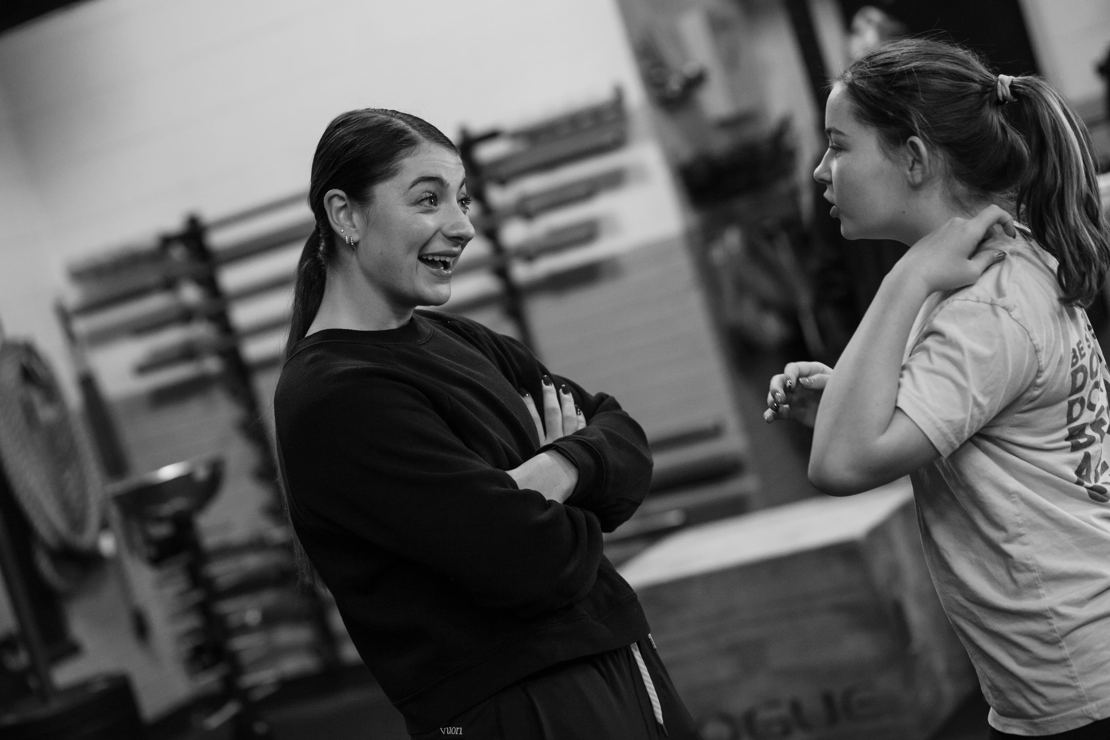 Coach helping a member with form